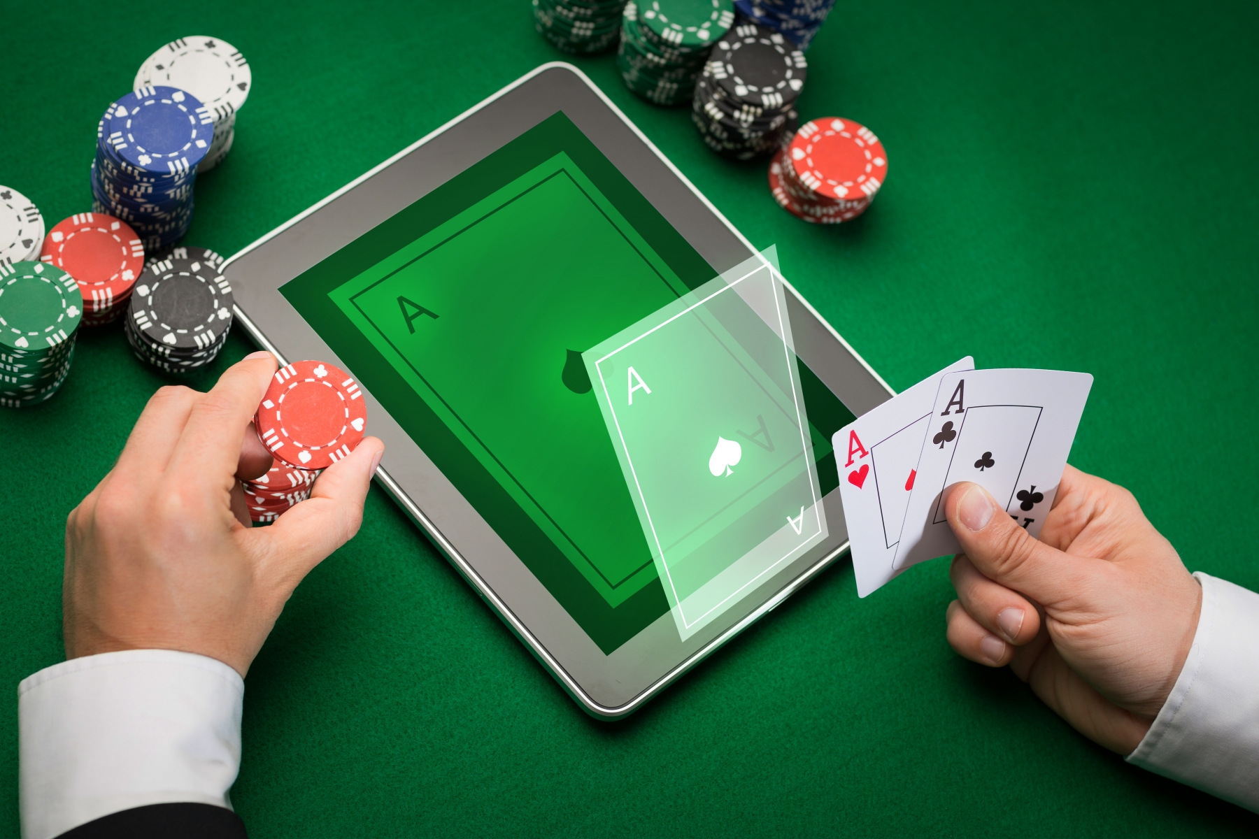 10813040-casino-poker-player-with-cards-tablet-and-chips